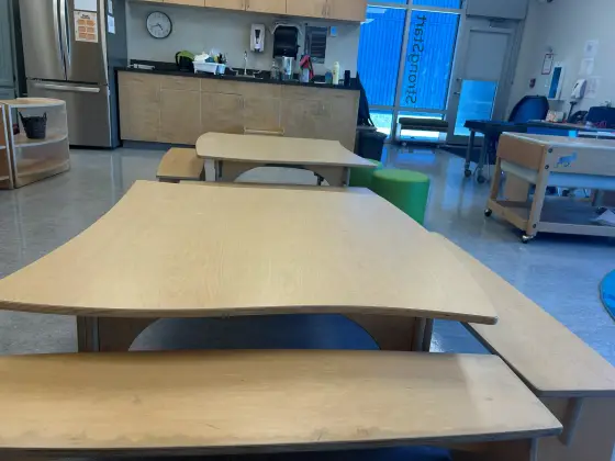 Tables and benches beside the snack counter in the Butterfly Room